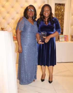 Justice Sylvia Hinds-Radix, left, presents Outstanding Public Servant Award to Assembly Member Rodneyse Bichotte Hermelyn, chair of the Brooklyn Democratic Party.