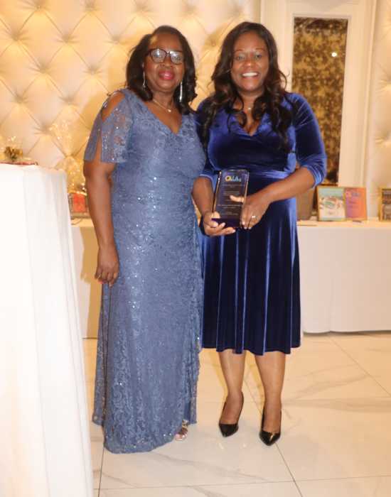 Justice Sylvia Hinds-Radix, left, presents Outstanding Public Servant Award to Assembly Member Rodneyse Bichotte Hermelyn, chair of the Brooklyn Democratic Party.