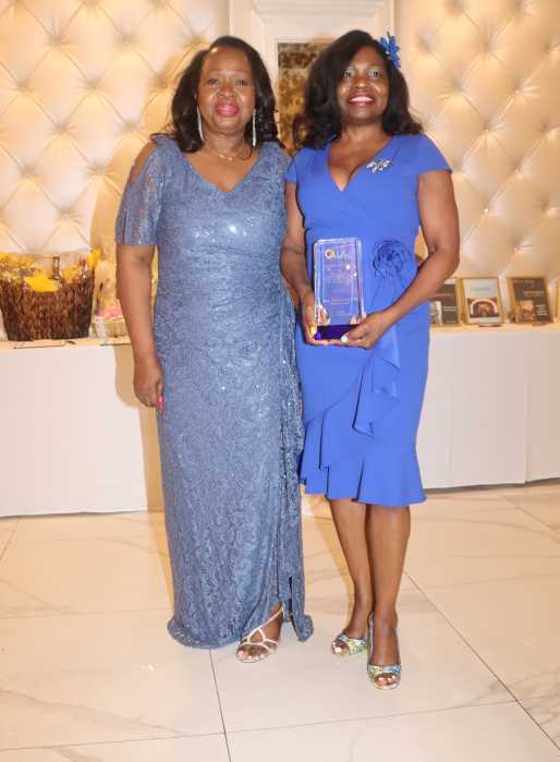 Kings County Administrative Judge Genine D. Edwards, right, receives the Outstanding Jurist Award from Justice Sylvia Hinds-Radix.