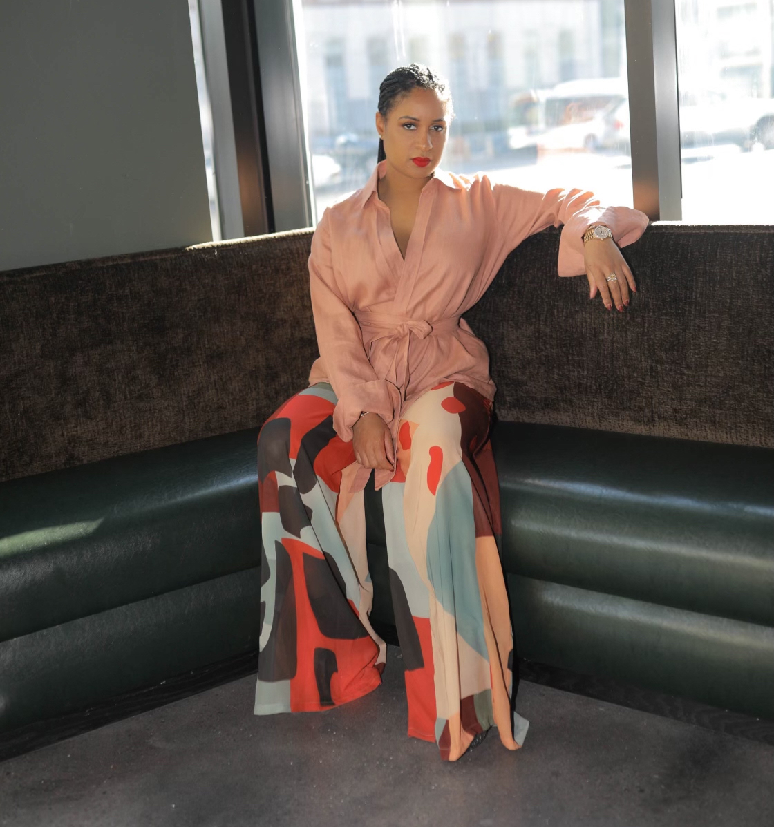 Aliyah Huey, co-owner of Continent Brooklyn, stands inside the dining room of the Caribbean-inspired restaurant located within the Indigo Hotel in Brooklyn, N.Y.