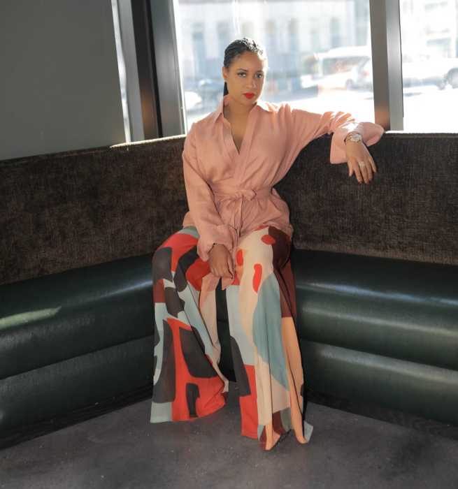 Aliyah Huey, co-owner of Continent Brooklyn, stands inside the dining room of the Caribbean-inspired restaurant located within the Indigo Hotel in Brooklyn, N.Y.