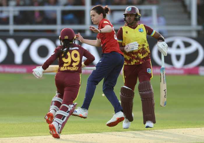 England's Emily Arlott in action with West Indies' Mandy Mangru and Hayley Matthews during the Women's T20 International at the St. Lawrence Ground, Kent, Britain on May 21, 2025.