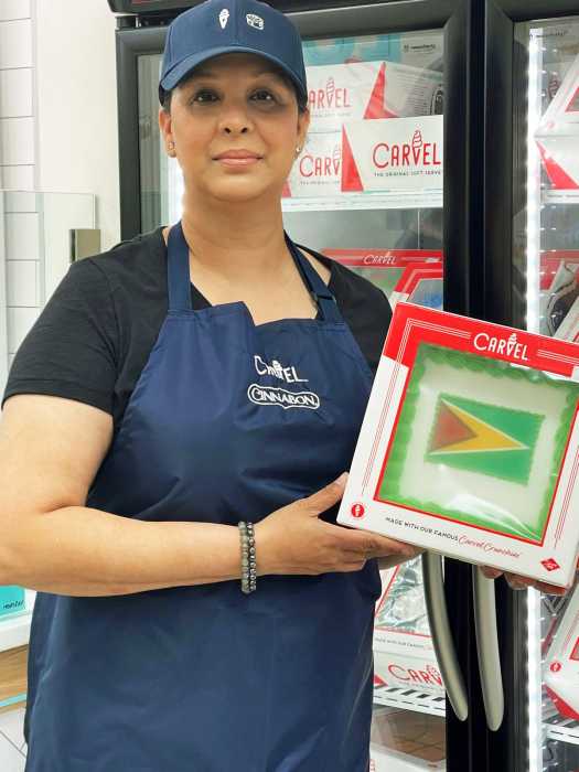Romesha Deen, owner of the only Guyanese-owned Cinnabon and Carvel in the world, poses inside her Hollis, Queens store.