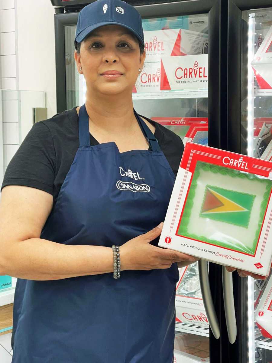 Romesha Deen, owner of the only Guyanese-owned Cinnabon and Carvel in the world, poses inside her Hollis, Queens store.