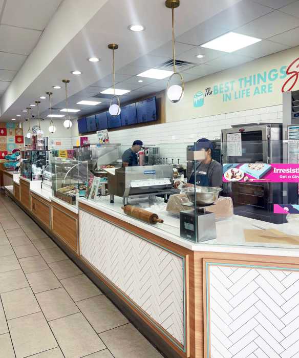 The dining area inside the Hollis Carvel is bright and inviting, often filled with families enjoying ice cream together, even in winter.