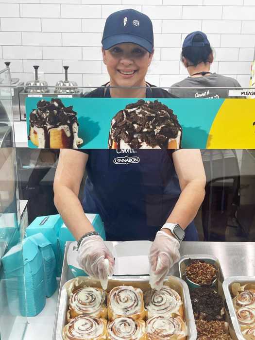 Romesha Deen serves up more than just cinnamon rolls — she brings warmth, smiles, and a welcoming spirit that makes every visit to her store feel like home.
