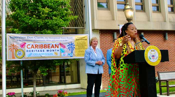 Monroe University Adjunct Professor Ameil Stoley addressed an audience at the Hempstead Town Board & the Department of Community Affairs Caribbean Heritage Month Celebration on May 6, on the Senior Councilwoman Dorothy L. Goosby Plaza on May 6, 2025 as Town Clerk Kate Murray looks on.