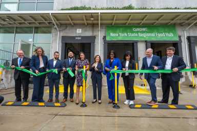 Governor Kathy Hochul (sixth from left) and other officals celebrate the completion of $45 million NYS Regional Food Hub in the Bronx on June 17, 2025. Hunts Point-Based Food Hub will improve access to healthy foods for underserved populations. Facility will increase food distribution by 600 %, creating 200 new jobs and will connect upstate farms to downstate markets.