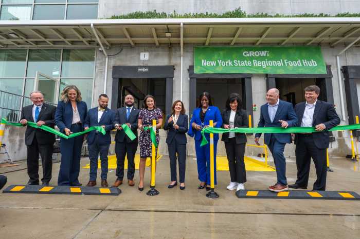 Governor Kathy Hochul (sixth from left) and other officals celebrate the completion of $45 million NYS Regional Food Hub in the Bronx on June 17, 2025. Hunts Point-Based Food Hub will improve access to healthy foods for underserved populations. Facility will increase food distribution by 600 %, creating 200 new jobs and will connect upstate farms to downstate markets.