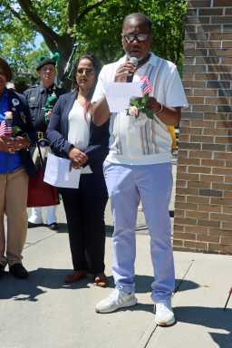 Brooklyn Borough President Candidate Khari Edwards pays tribute in poem, at Memorial Day 2025 Ceremony by the Brooklyn Canarsie Lions, flanked by Assembly Member Jamie Williams, to his immediate right.