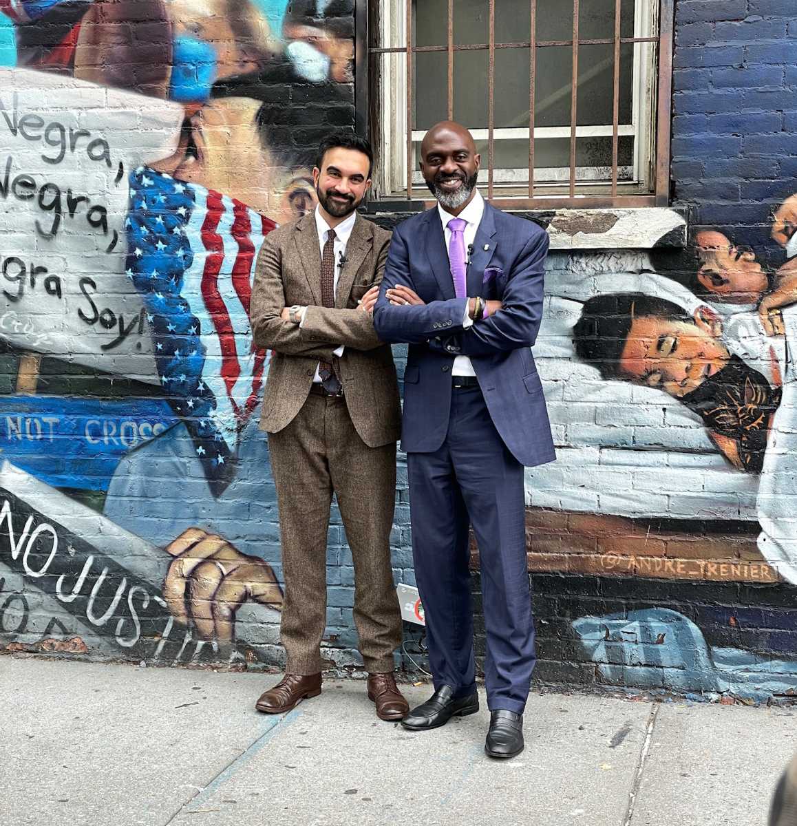 Mayoral hopefuls Michael Blake and Zohran Mamdani pose together after announcing a cross-endorsement, highlighting shared goals including rent relief, free public transit, and mental health investment.