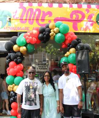 From left, Patrick Victor, proprietor of Mr. P's Homemade Ice Cream shop, NYC Councilmember Rita Joseph,District 40, and a supporter in front of the 1397 Nostrand Ave., Brooklyn colorful facade on Juneteenth, June 19, where scores of free scoops were shared in the Little Caribbean community.