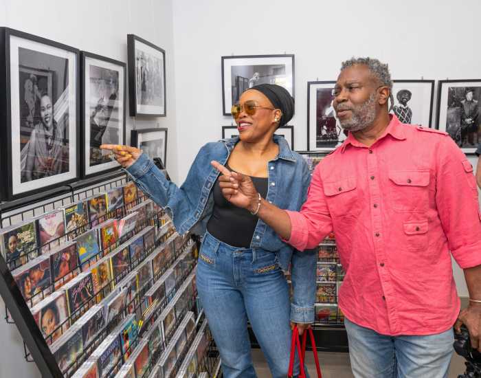 Queen Ifrica and Ajamu Myrie view Queen Ifrica’s portrait at he VP Records Cultural Center in Jamaica, Queens.