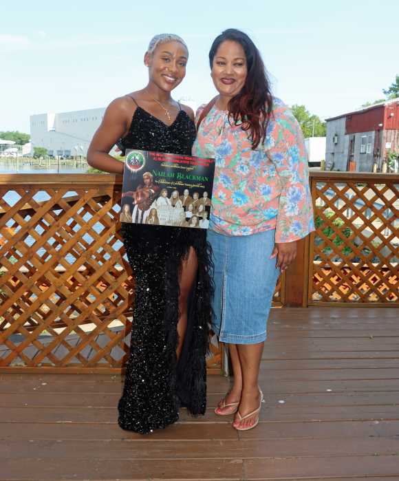 Nailah Blackman, left, displays award with Assembly Member Jaime Williams.