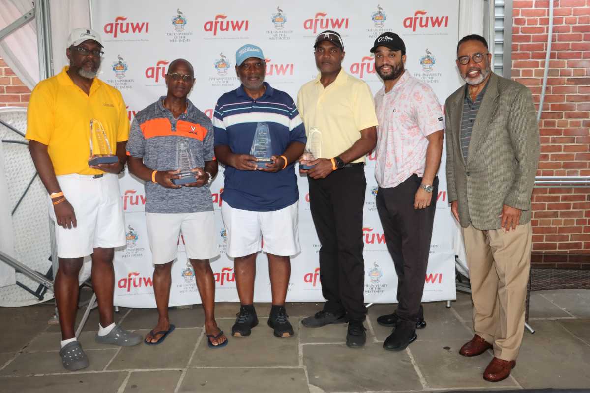 AFUWI Board Chairman and Chair of Obstetrics and Gynecology at Brookdale University Medical Center in Brooklyn, Dr. Cyrus McCalla, right, with some tourney winners.