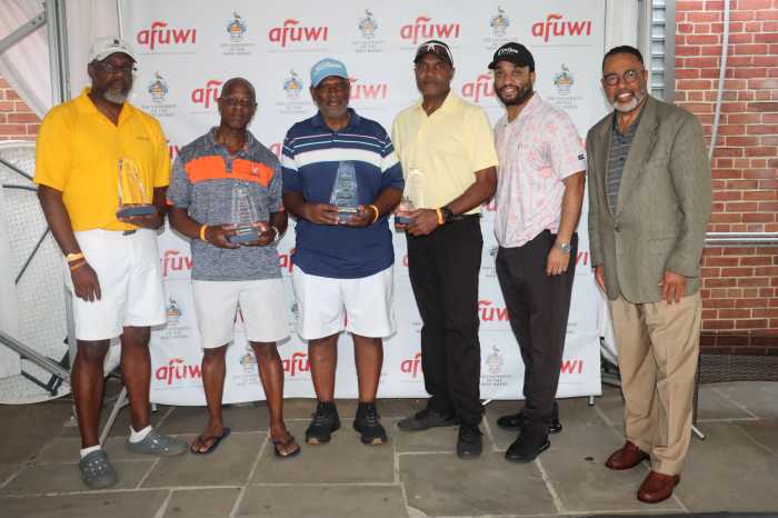AFUWI Board Chairman and Chair of Obstetrics and Gynecology at Brookdale University Medical Center in Brooklyn, Dr. Cyrus McCalla, right, with some tourney winners.
