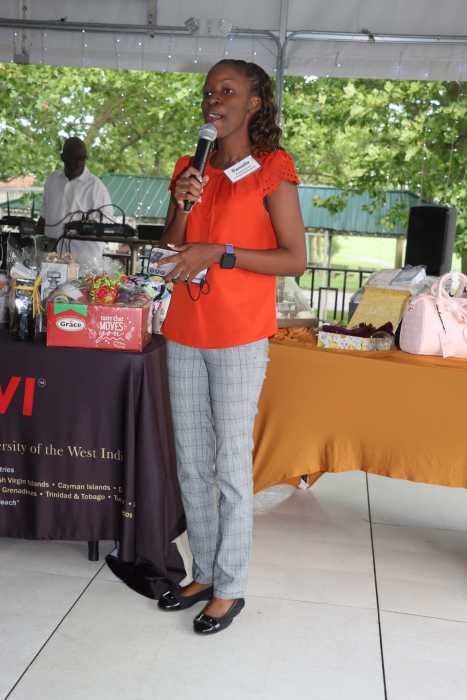 Danielle Brown, a Jamaican-born final-year medical student at UWI Mona Campus in Jamaica and AFUWI scholarship recipient, addresses reception.
