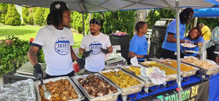 Workers of Trini Jam Restaurant provided eats for the event.