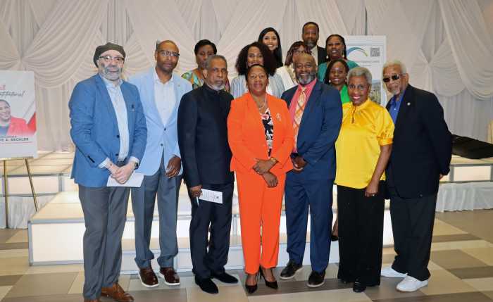 Trinidad and Tobago Opposition Leader Pennelope Beckles-Robinson, center in tangerine outfit, with members of the New York-based Caribbean Diaspora United, Inc. (CDU).