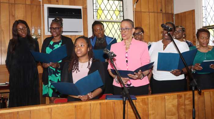 Dianne Brown, left, back row, signs with FSUMC's United Voices of Faith (UVOP) during Graduation Sunday.