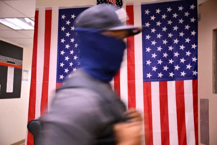 A masked ICE agent in 26 Federal Plaza on July 22, 2025.