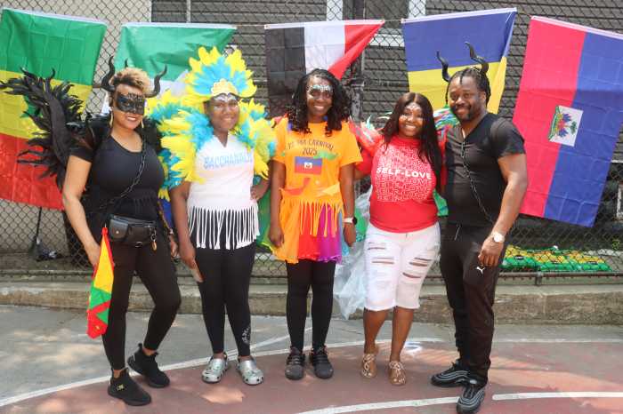 Parent-Teachers Association Members in carnival costumes, from left, Thereshia Felix (Grenada), Varessa Ford Smikle (Trinidad and Tobago), Shirley Alexis-Greaves (Haiti), Sharmaine Sprull (Jamaica) and Ezra Lewis (St. Vincent and the Grenadines).