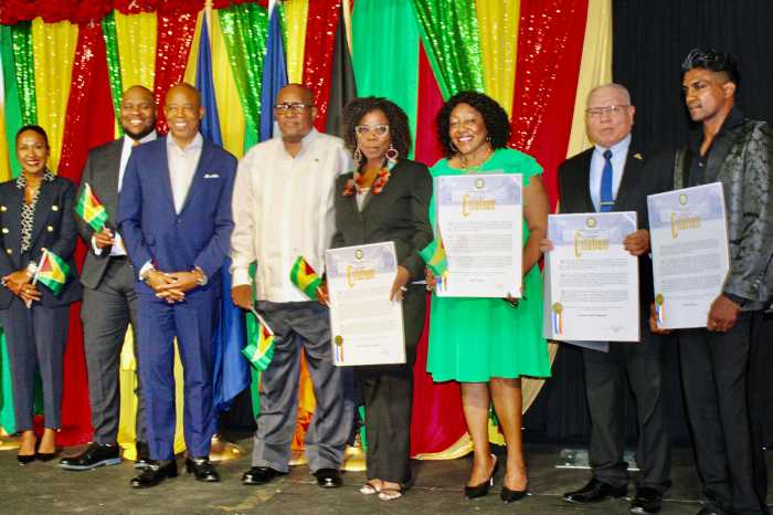 From left, First Deputy Commissioner NYPD, Tonia Kinsella of Guyanese lineage, Chief Technology Officer for New York Matthew C. Fraser, of Guyanese lineage, Mayor Eric L. Adams, Consul General to New York, Michael E. Brotherson, honorees Claire Patterson-Monah, Sherif Fraser, Isiah Chappelle, and Elton Dharry, holding Citation, during a dynamic heritage reception on July 22, at Gracie Mansion in Manhattan.