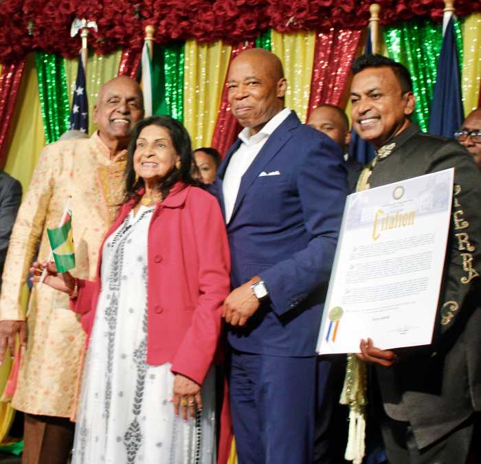 The elderly parents of "Guyana Baboo singer" left, join Mayor Adams, and Terry Gajraj, an honoree, on stage at Grace Mansion in Manhattan, during a dynamic Guyanese heritage reception on July 22.