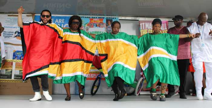 A group of dancers perform to late Guyanese hitmaker Dave Martins' song "Not a Blade of Grass,” at the Annual Guyana Caribbean Fun Day in Monte Irvin Orange Park, in Orange, NJ on July 13.