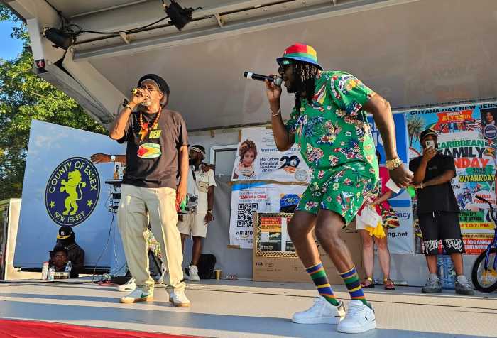 Popular reggae singer Pablo G, left and sensational recording artist Ryan Lynton, aka Gucci Boss, revving up the crowd at the annual festival in Monte Irvin Orange Park, Orange NJ, on July 13.