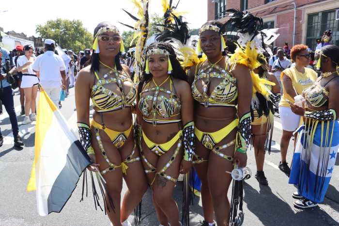 Representing the Garifuna Culture, L-R: Jasmine Baltazar, Shivonnie Brown and Elizabeth Baltazar playing with Skymaxx Mas in WIADCA Carnival Parade 2024.