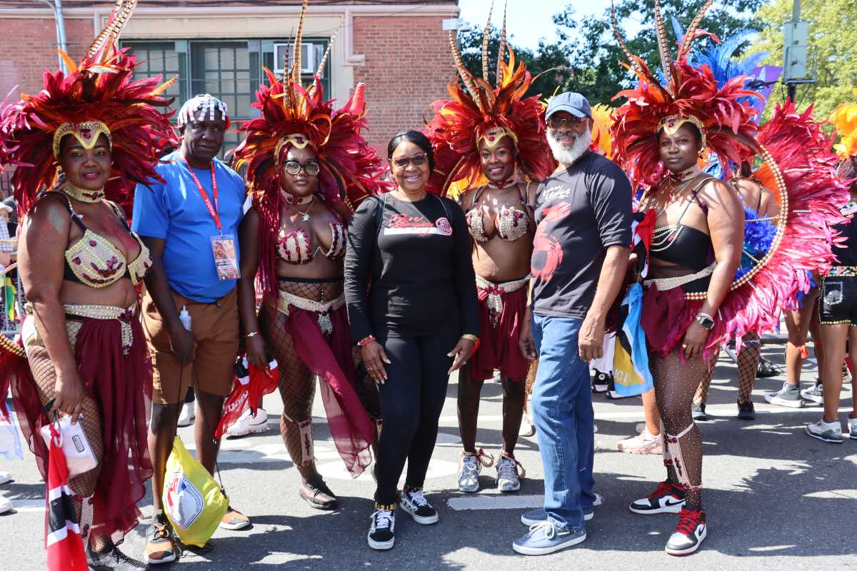 Edwin Worrell, second from left, Derek Noel, second from right, with masqueraders in Deck Productions, Branches and Associates and Mango Tree Productions' "A Touch of Class" in WIADCA Carnival Parade 2024.