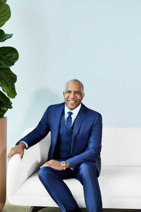 author of Lead Boldly man in suit sitting on couch