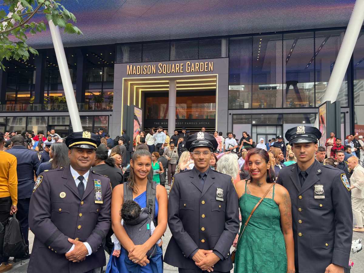 Daniel Clement (center) stands proudly in his NYPD uniform, flanked by his family, marking a milestone in the Corman family legacy.