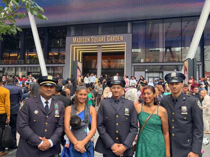Daniel Clement (center) stands proudly in his NYPD uniform, flanked by his family, marking a milestone in the Corman family legacy.