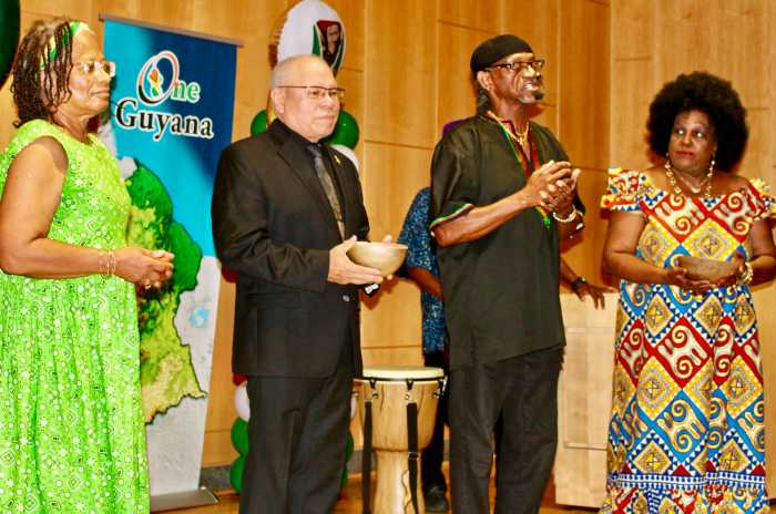 From left, a participant, Josiah Chappelle, Winston Jaggae'Hoppie, and Lady Ira Lewis during a moving libation ceremony, during an Emancipation Observance on July 31, hosted by the Guyana Consulate to New York, at Medgar Evers College in Brooklyn.