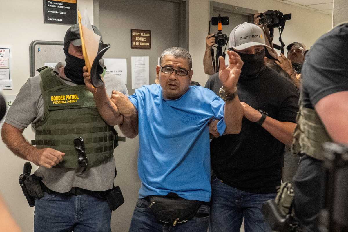 A migrant is detained by federal immigration officers at U.S. immigration court in Manhattan, in New York City, U.S., July 23, 2025.