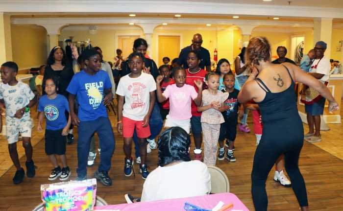 Teaching the kids to do the Cha-cha-cha dance.