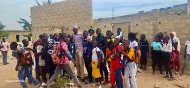 Imam Shaykh Safraz Bacchus, center engaged several African children during his 2024 trip to continue his humanitarian work, He distributed school supplies and food hampers.