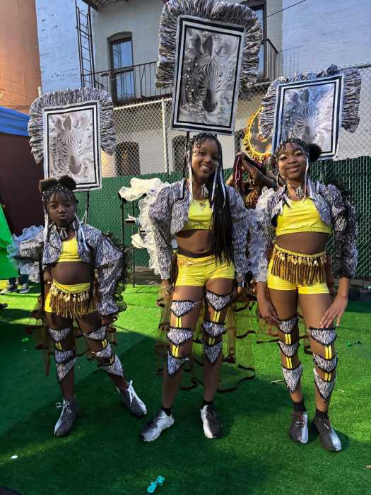 Models Mayah, Neavah, and Ariana portray the “Okapi” section of the band ‘Splendor of the Amazon.’