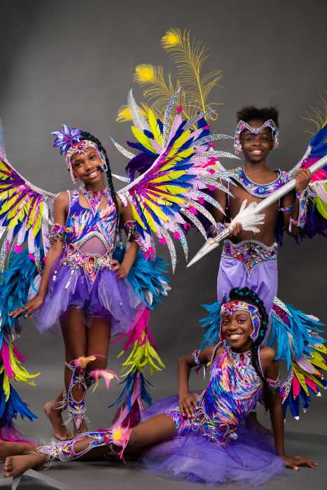 Masqueraders portray costumes for the "Jewel of the Crown" section.