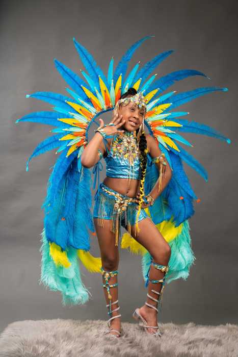 The model displays the costume for the "Enchanted" section of the band Royal Kingdom.
