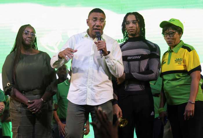 Jamaica's Prime Minister Andrew Holness addresses supporters, next to his wife and member of parliament Juliet Holness, their son Adam, and Holness' mother Sonia Harvey, after the ruling Labour Party declared victory in the general election, ushering in a third consecutive term for Holness, in Kingston, Jamaica, September 4, 2025.
