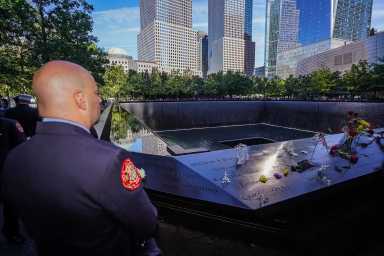 A firefighter stands at the 9/11 Memorial on Sept. 11, 2024. The FDNY lost 343 members in the Sept. 11, 2001 terrorist attacks on the World Trade Center.