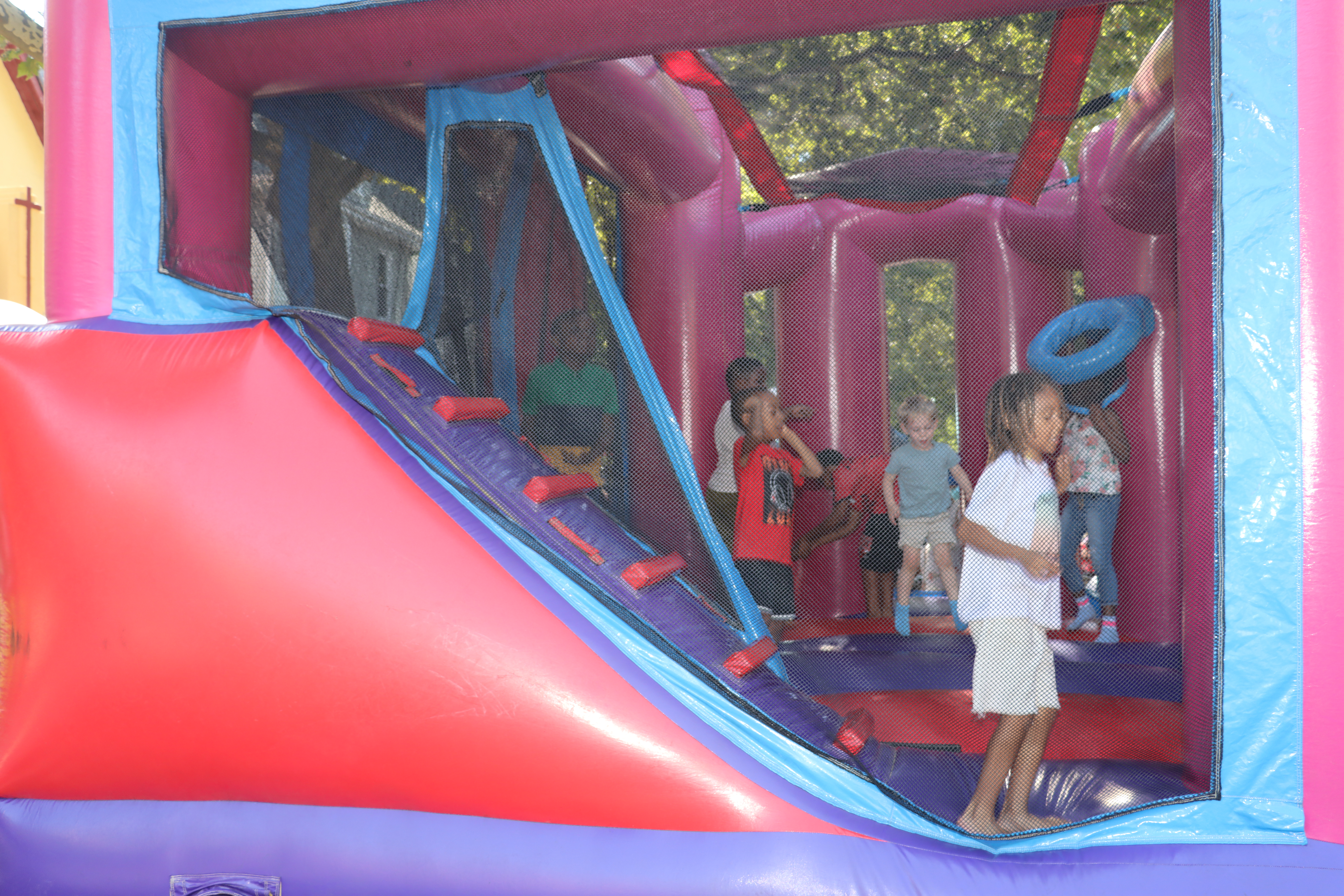 Children play in the Bounce House