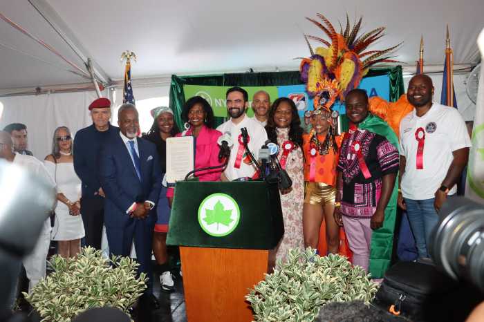 WIADCA Treasurer Dr. Ionie Pierce holds a citation on behalf of WIADCA flanked by elected and other officials.