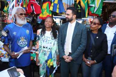 Trinidadian Ernest Skinner, founder of Caribbean Americans United in Support of Mamdani for Mayor, addresses Democratic Mayoral Nominee Zohran Mamdani at press conference on Saturday, Aug. 30, flanked by Caribbean elected officials, including Assemblywoman Monique Chandler-Waterman, second from left, City Council Member Rita Joseph, fourth from left, and Josue Pierre, the Haitian-American District Leader for the 42nd Assembly District in Brooklyn, right.