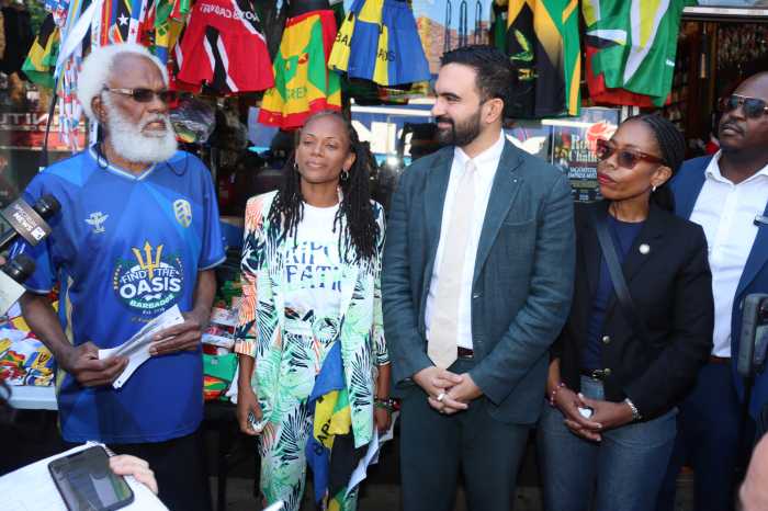 Trinidadian Ernest Skinner, founder of Caribbean Americans United in Support of Mamdani for Mayor, addresses Democratic Mayoral Nominee Zohran Mamdani at press conference on Saturday, Aug. 30, flanked by Caribbean elected officials, including Assemblywoman Monique Chandler-Waterman, second from left, City Council Member Rita Joseph, fourth from left, and Josue Pierre, the Haitian-American District Leader for the 42nd Assembly District in Brooklyn, right.