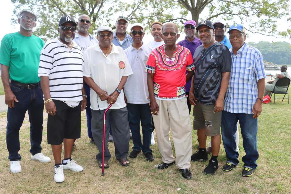 Rt. Hon. Glenver Jones, Grand Deputy Master, center, with Members of the Executive Committee of Grand Council and District Grand Masters of various District Grand Jurisdictions in NYC.