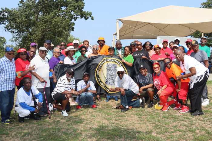 Rt. Hon. Glenver Jones, center, kneeling, with members of the Order, families, friends and supporters.